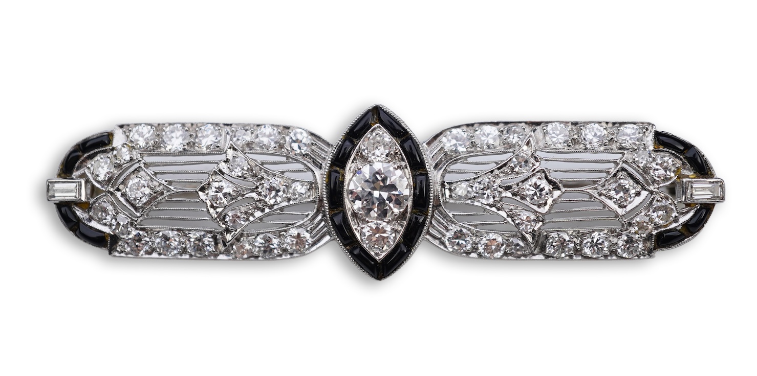 An Art Deco onyx and diamond brooch, 1920s